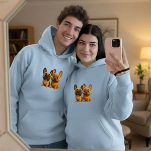Smiling young couple in matching light blue hoodies with cartoon French bulldog design taking mirror selfie